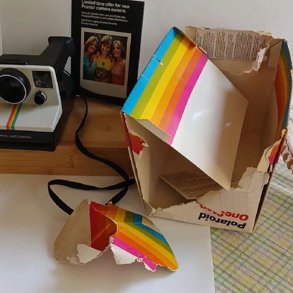 Vintage Polaroid Land One Step Instant Film Camera with Iconic Rainbow Design